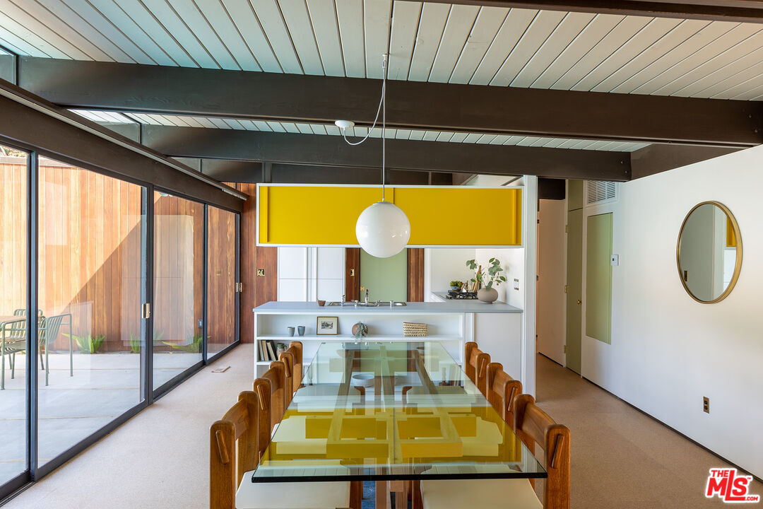272 Mesa Lila Road Glendale, CA 91208 - Photo 10 of 46 a view of a swimming pool with a table and chairs