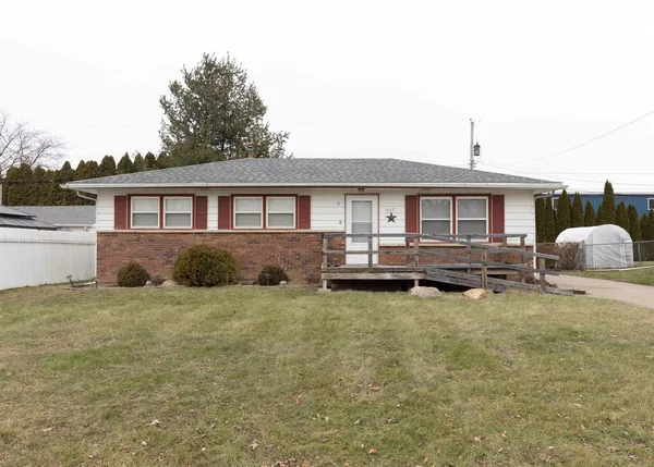 a house view with swimming pool and porch