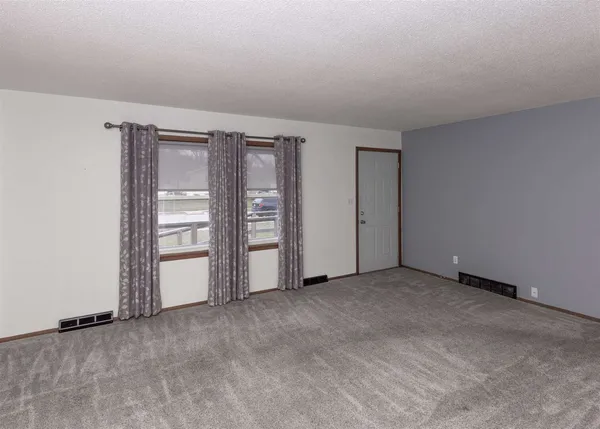 an empty room with closet area