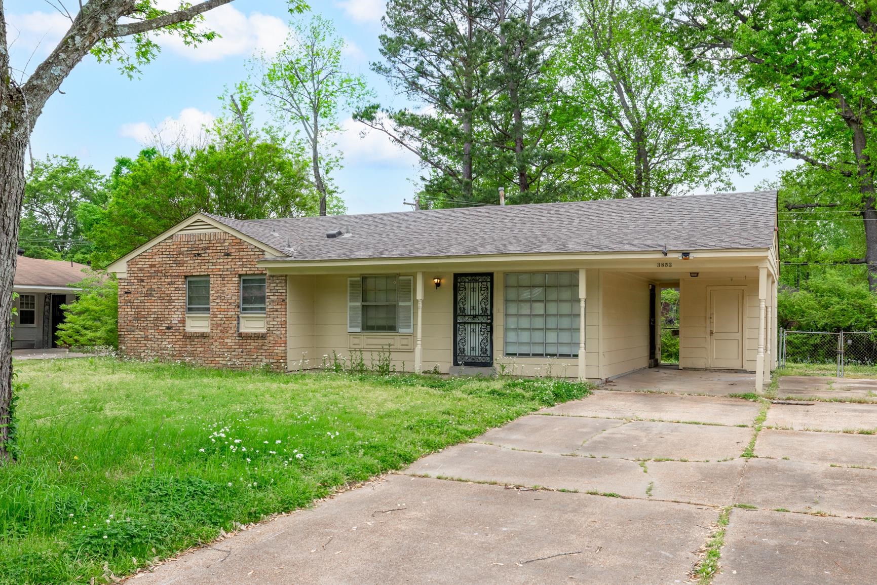 3853 Range Line Road Memphis, TN 38127 - Photo 3 of 18 Single story home featuring concrete driveway, roof with shingles, a carport, and a front yard