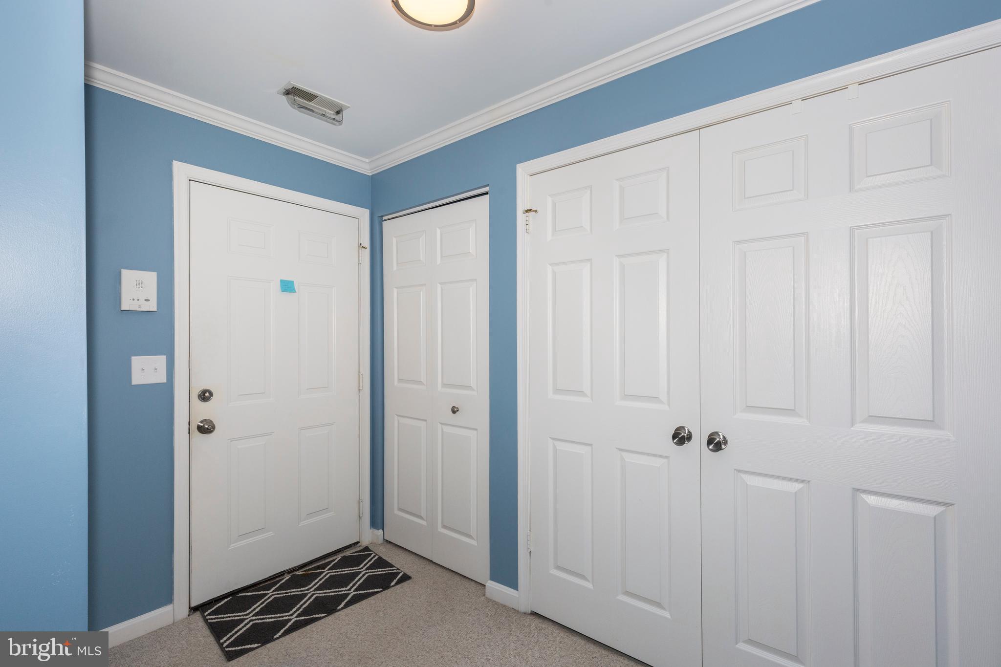 425 Pleasanton Road, Unit C23 Westminster, MD 21157 - Photo 21 of 48 Doorway with coat closet and laundry closet.