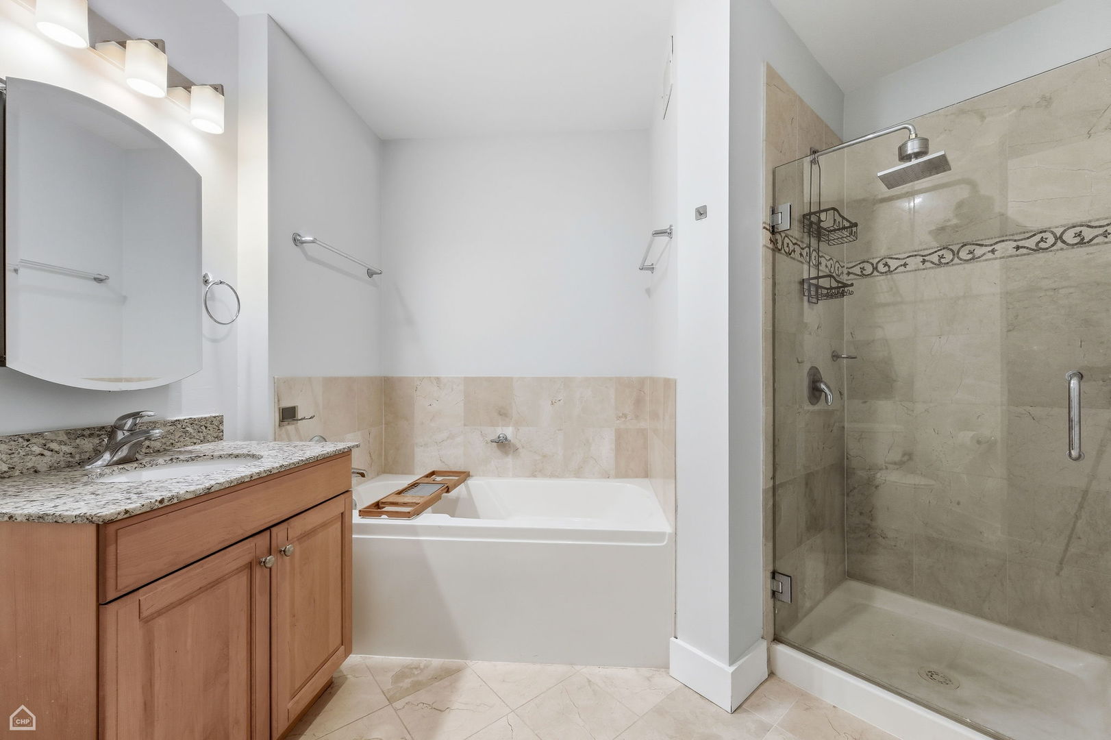 420 East Waterside Drive, Unit 1502 Chicago, IL 60601 - Photo 8 of 11 a bathroom with a granite countertop sink mirror and shower