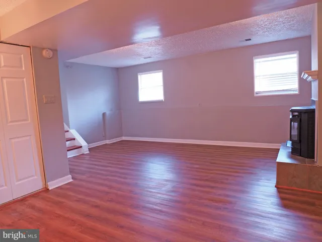 a a bathroom with a toilet and a shower curtain