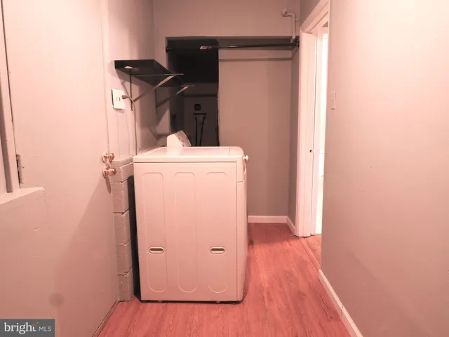 a view of an house with backyard space and a tree