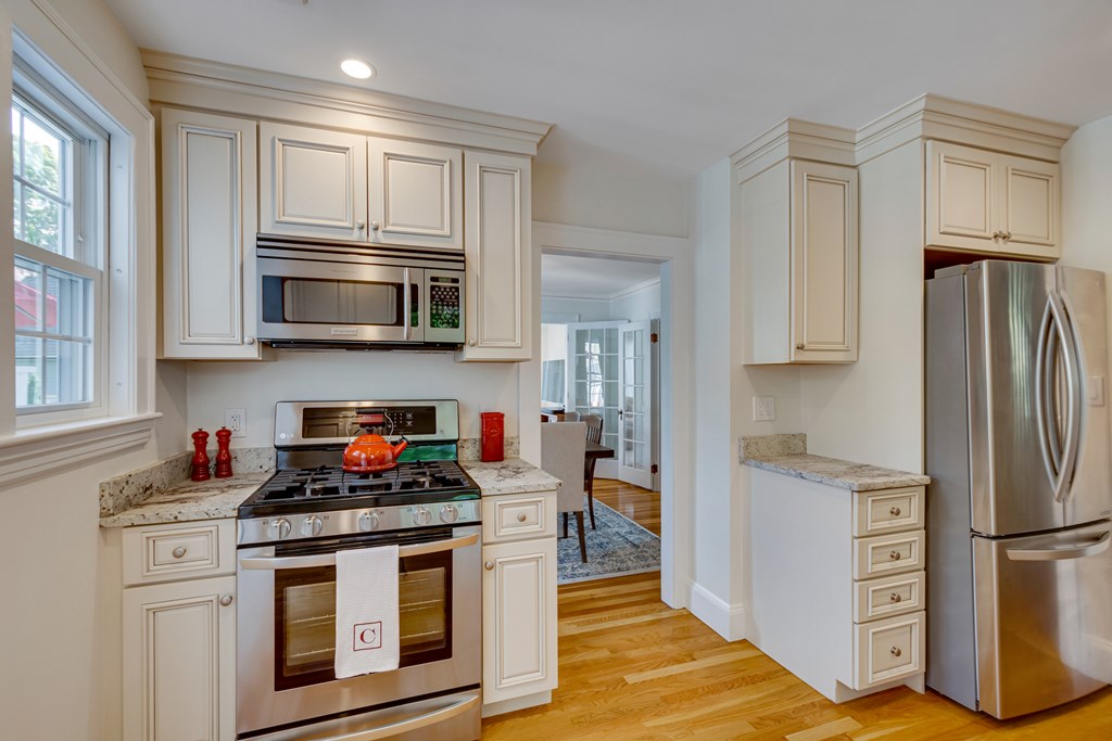 33 Ashcroft Road Medford, MA 02155 - Photo 14 of 28 a kitchen with stainless steel appliances a stove microwave and refrigerator