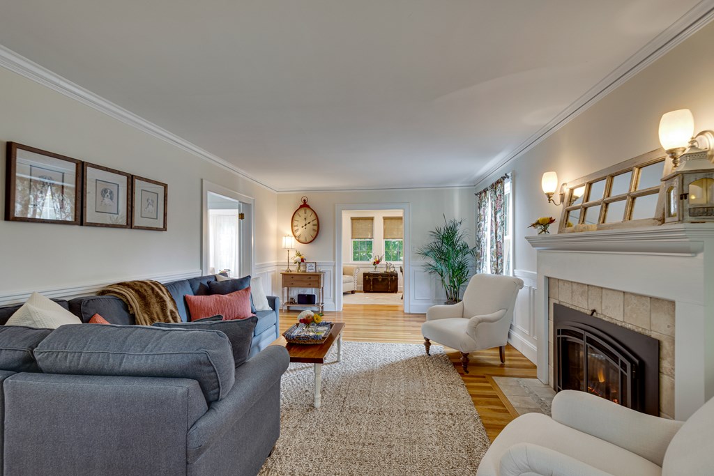 33 Ashcroft Road Medford, MA 02155 - Photo 3 of 28 a living room with furniture and a fireplace