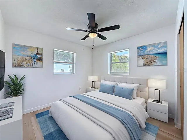 a balcony with furniture and a floor to ceiling window