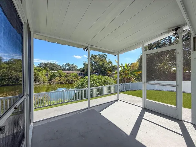 a view of a backyard with plants and a garden