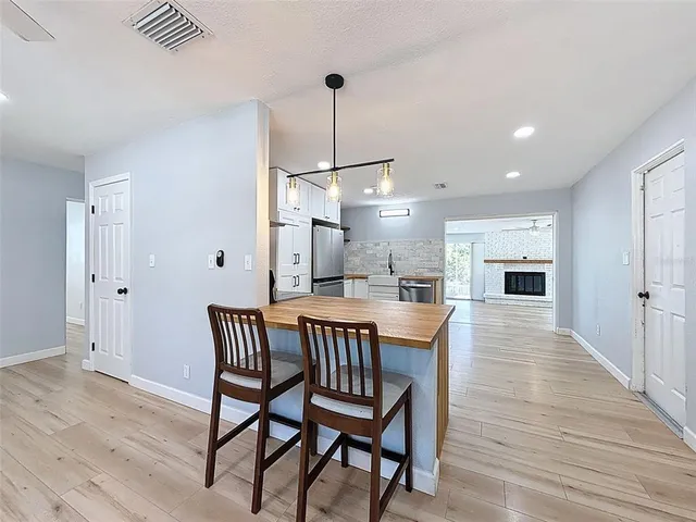 a dining room with furniture and window