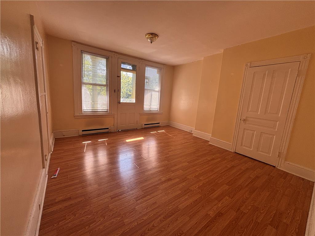 822 5th Street North Reading, PA 19601 - Photo 2 of 7 Warm wood-look flooring extends throughout this naturally illuminated room.