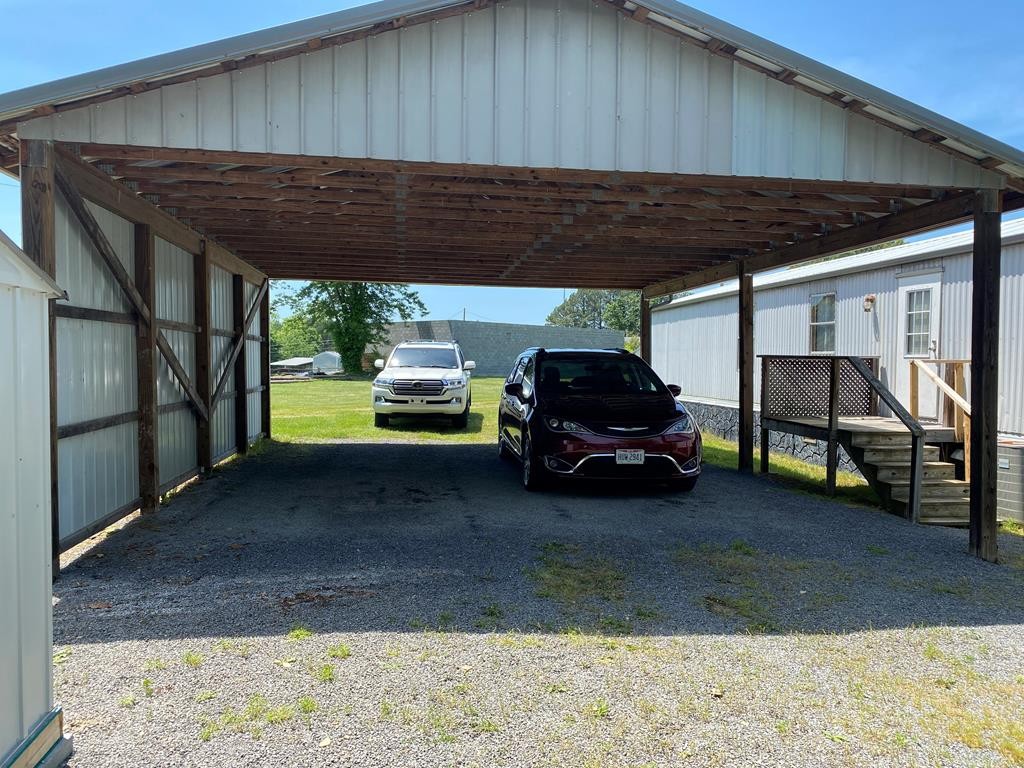 313 Lonesome Pine Road Bybee, TN 37713 - Photo 5 of 48 a car parked in front of house