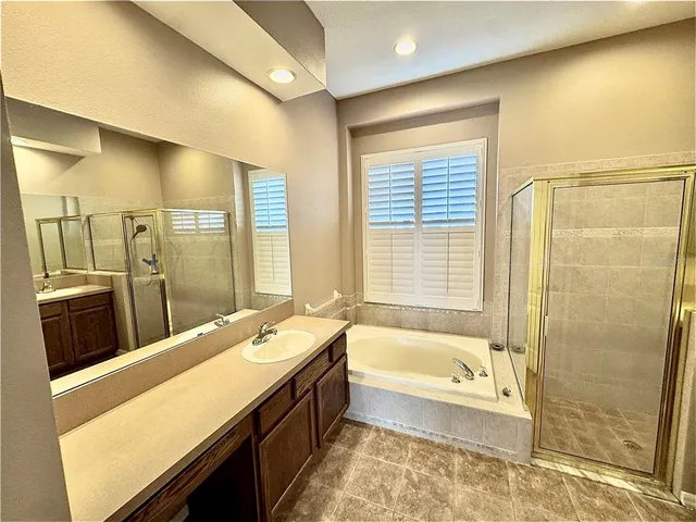 a bathroom with a bathtub and a sink