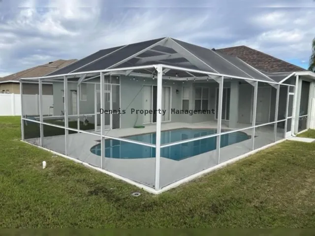 a view of a house with a yard porch and sitting area