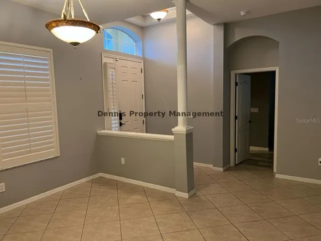 a view of a kitchen with a sink and a refrigerator
