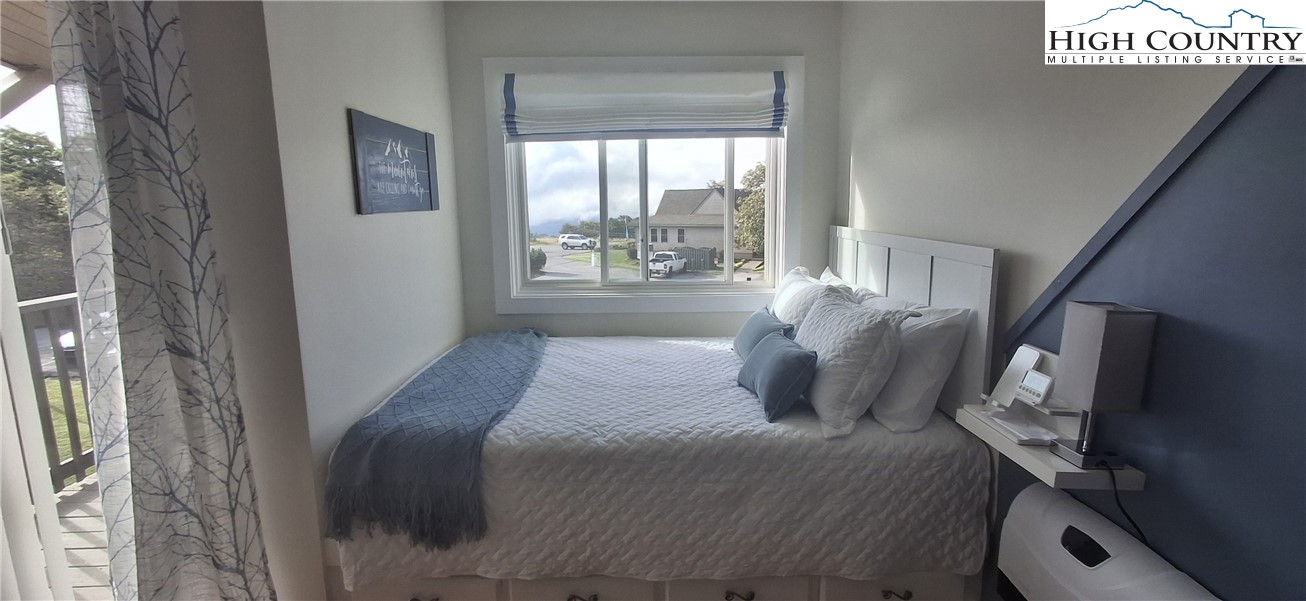 301 Pinnacle Inn Road, Unit 4303 Beech Mountain, NC 28604 - Photo 5 of 37 a bedroom with a bed and a window