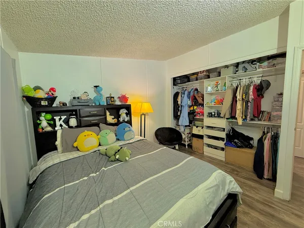 a bed room with a bed and a gym machine