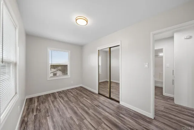 a bathroom with a sink toilet vanity and tub