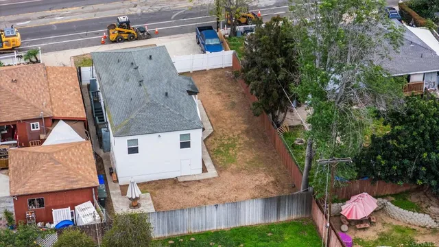 an aerial view of residential houses with outdoor space
