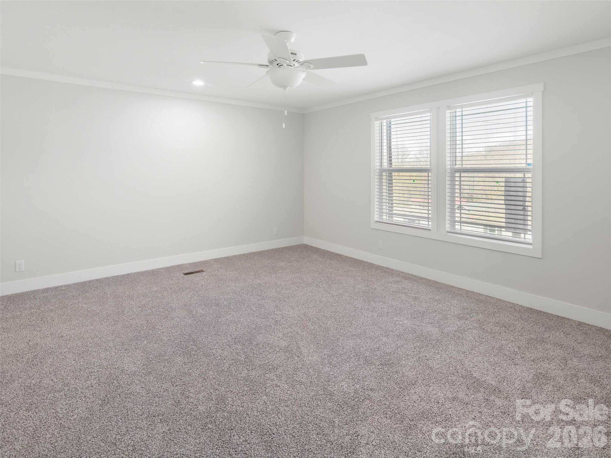 502 Hutch Mountain Road Fletcher, NC 28732 - Photo 16 of 26 an empty room with a window
