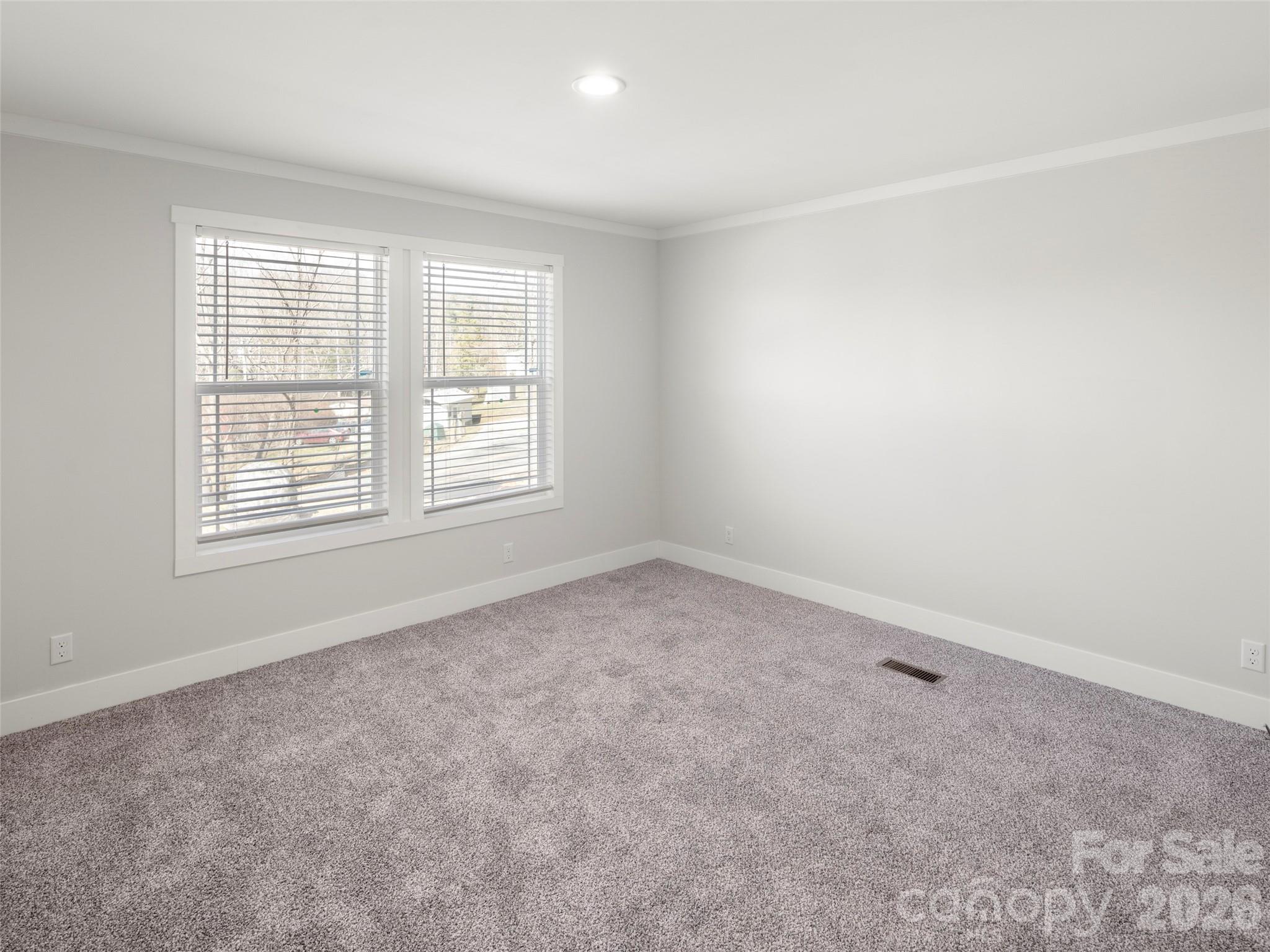 502 Hutch Mountain Road Fletcher, NC 28732 - Photo 20 of 26 an empty room with a window