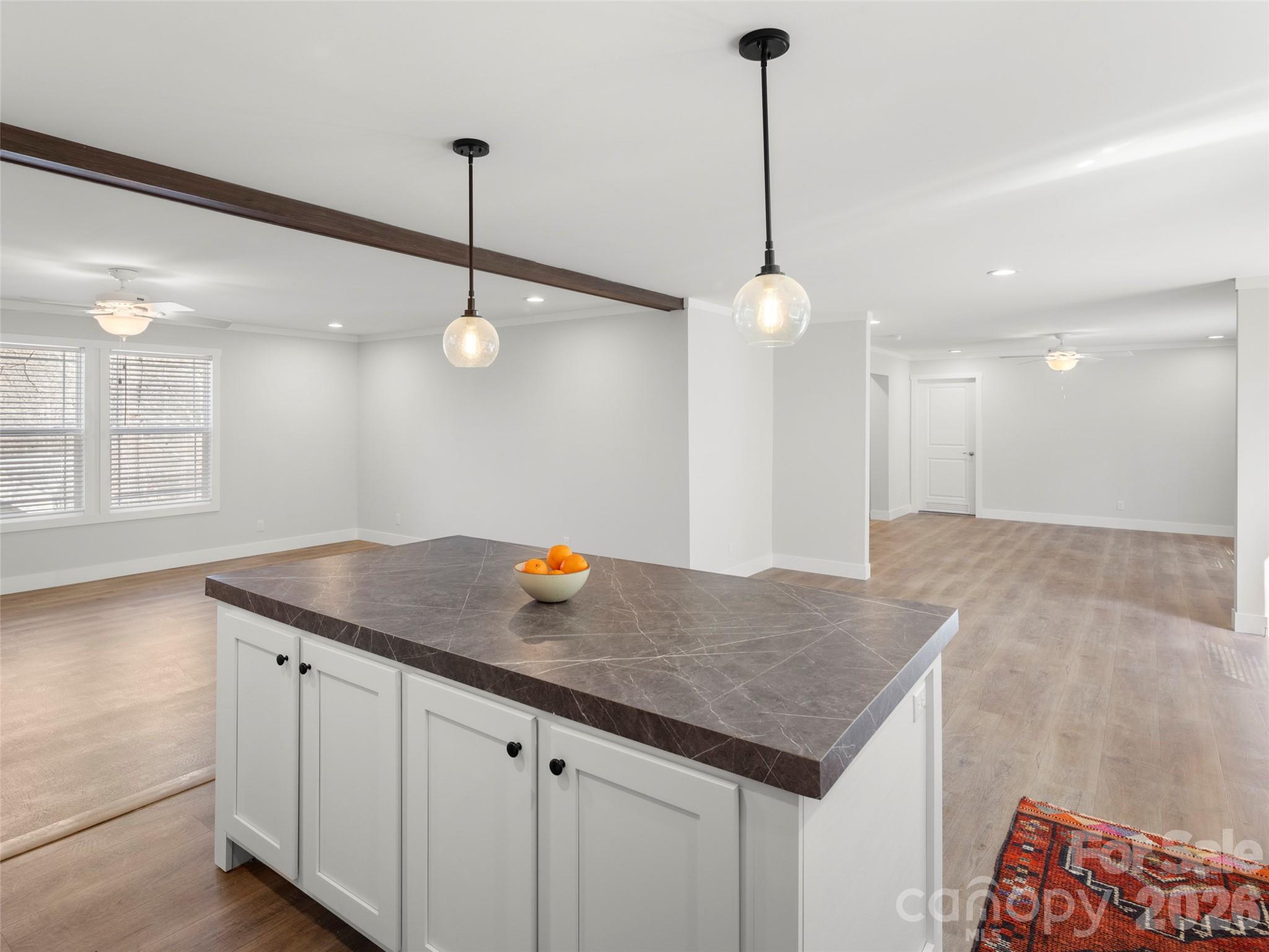 502 Hutch Mountain Road Fletcher, NC 28732 - Photo 2 of 26 a kitchen with a counter and ceiling fan