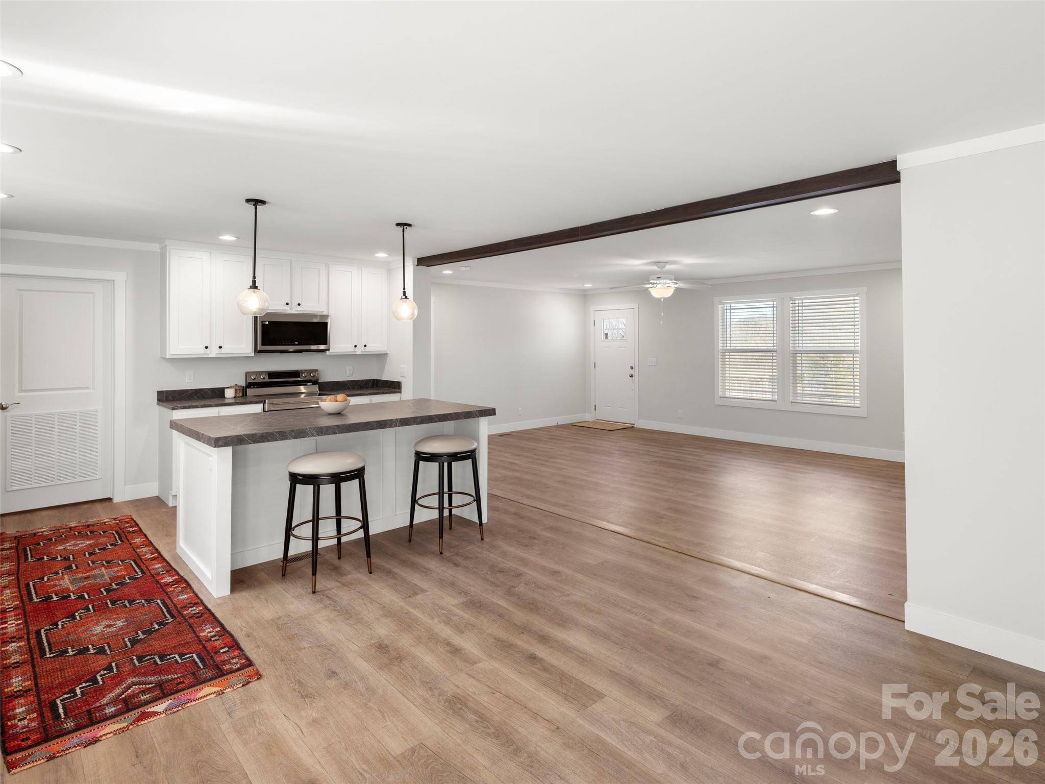 502 Hutch Mountain Road Fletcher, NC 28732 - Photo 8 of 26 a view of kitchen with sink microwave and cabinets