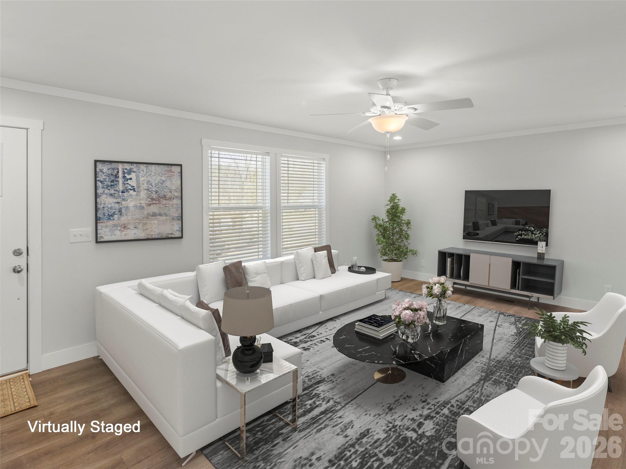 502 Hutch Mountain Road Fletcher, NC 28732 - Photo 10 of 26 a living room with furniture a chandelier and a flat screen tv