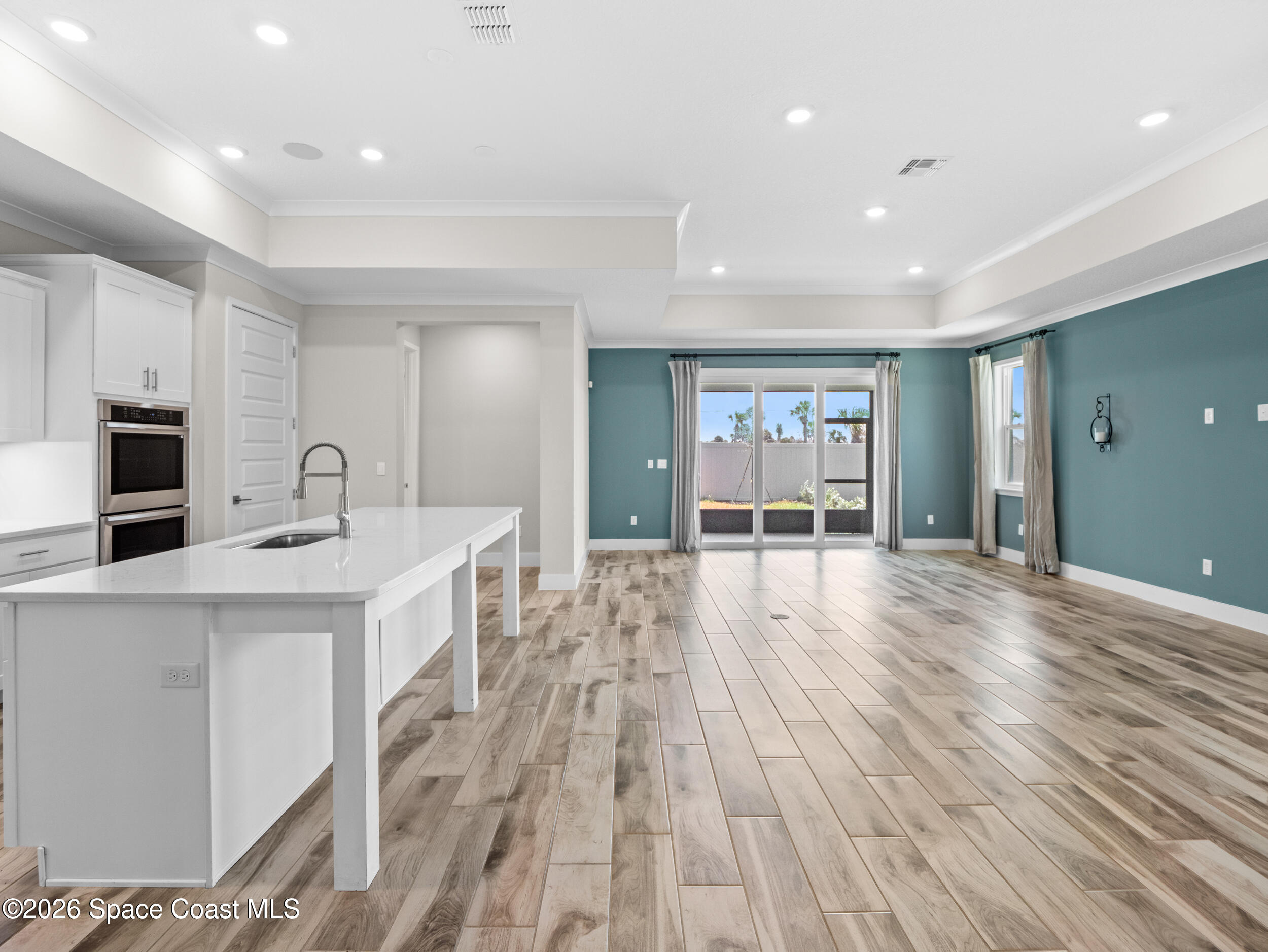 27 Gulfstream Way Satellite Beach, FL 32937 - Photo 5 of 26 a open kitchen with kitchen island a sink stainless steel appliances and cabinets