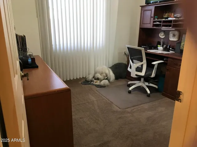 a view of a swimming pool with an outdoor seating and a yard