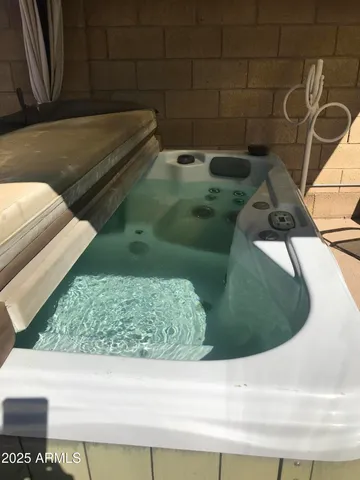 a room with a bed and a mirror