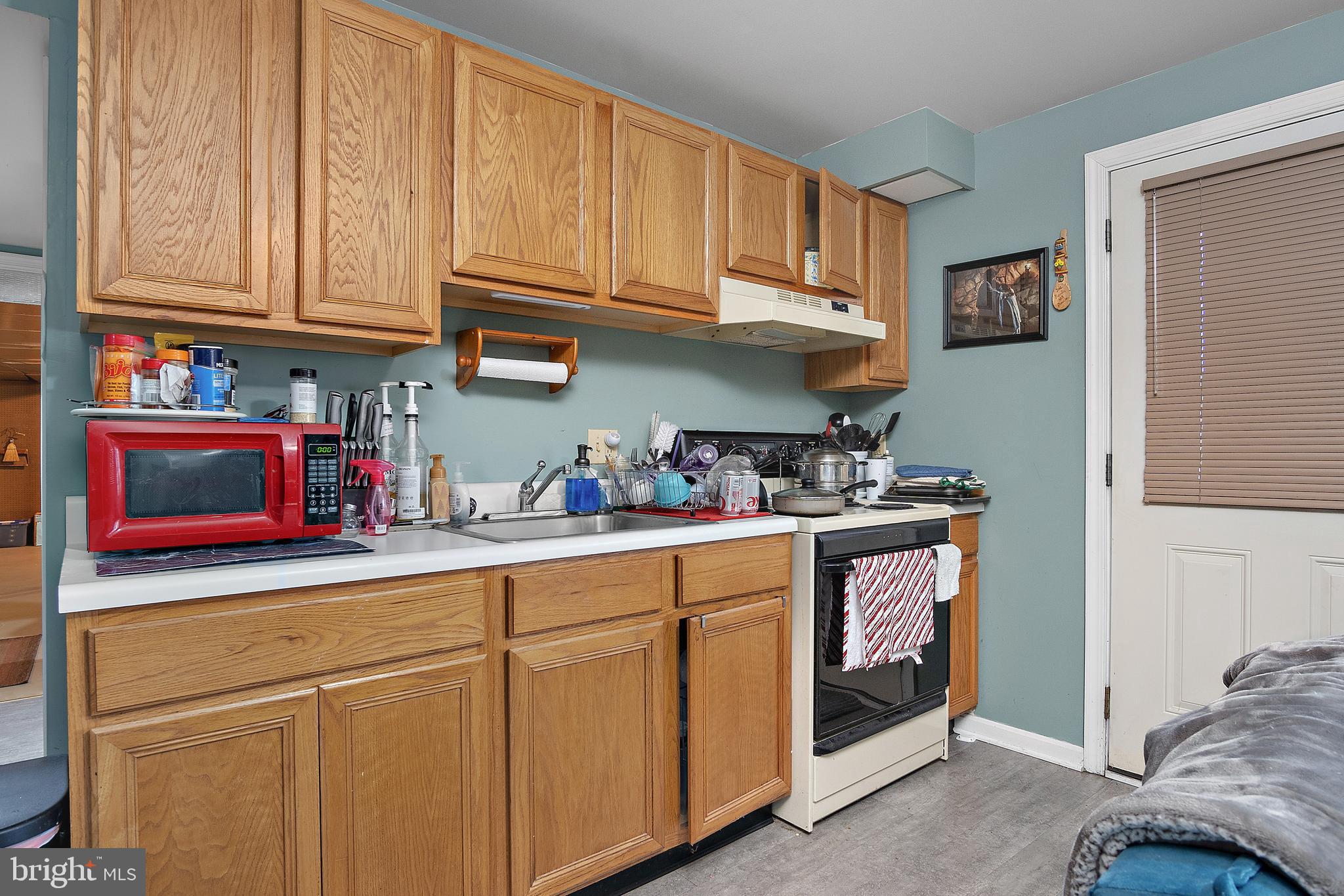 13810 Franks Run Road Smithsburg, MD 21783 - Photo 46 of 72 a kitchen with stainless steel appliances granite countertop a refrigerator and a stove top oven