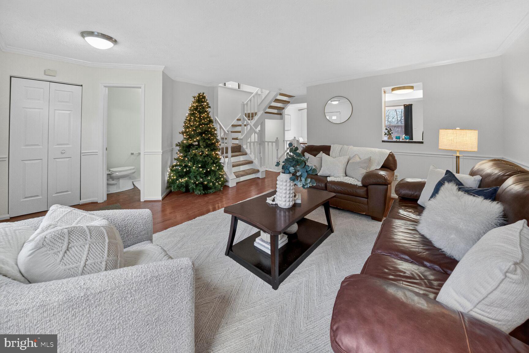 4303 Thistlewood Terrace Burtonsville, MD 20866 - Photo 2 of 26 a living room with furniture and wooden floor