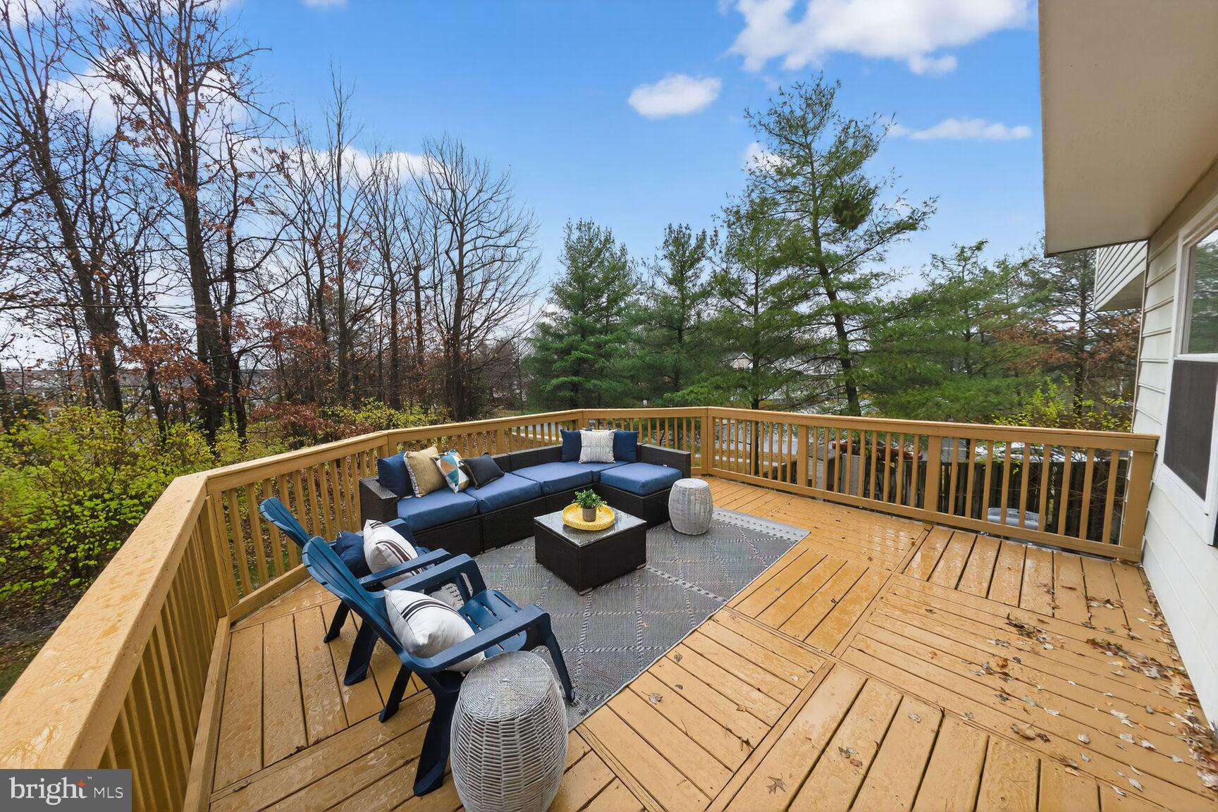 4303 Thistlewood Terrace Burtonsville, MD 20866 - Photo 24 of 26 a view of a balcony with chairs and wooden floor