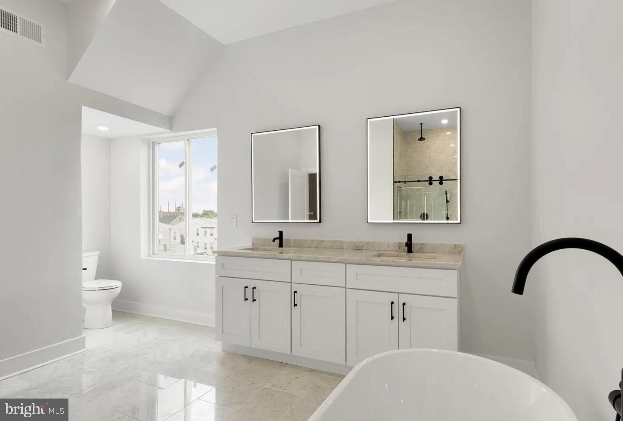 2719 Lefevre Street Philadelphia, PA 19137 - Photo 32 of 33 Sleek modern bathroom with natural light.
