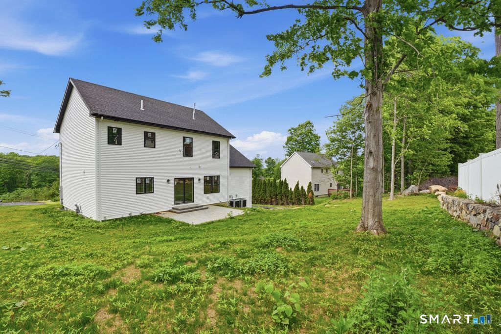 796 Maple Hill Road Naugatuck, CT 06770 - Photo 28 of 35 a view of a house with a yard