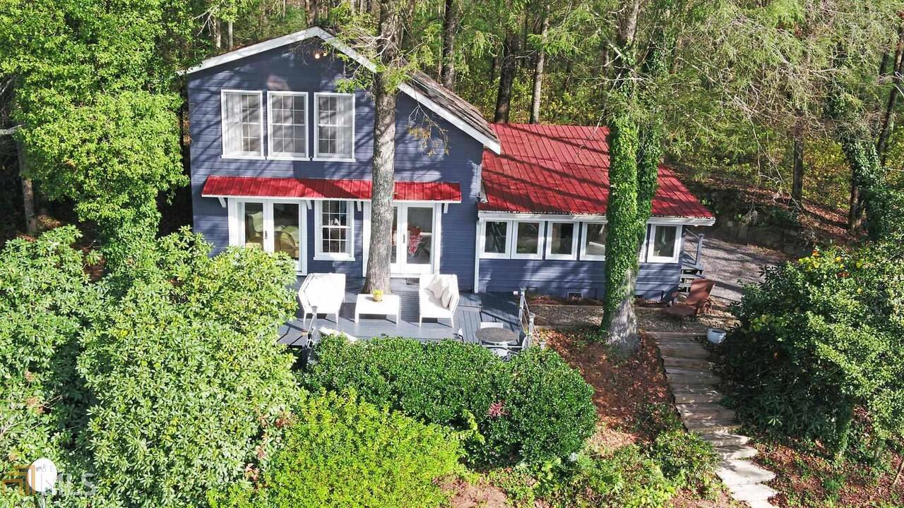 89 Arkansas Lane Tiger, GA 30576 - Photo 1 of 1 a view of a house with a yard patio and a garden