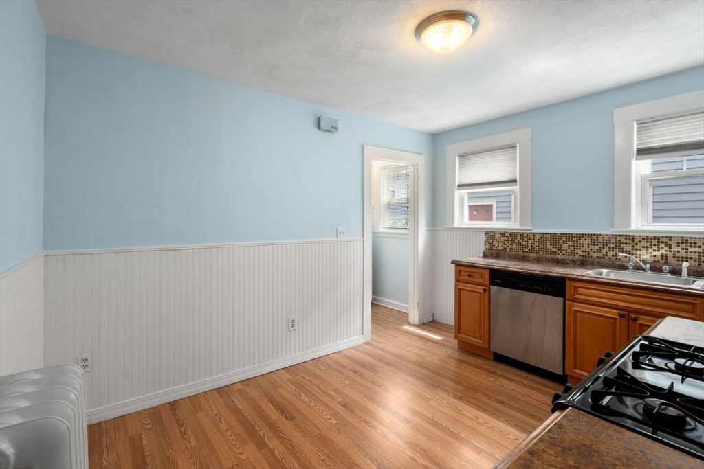 7 Winslow Road Belmont, MA 02478 - Photo 18 of 27 a kitchen with granite countertop a stove and cabinets