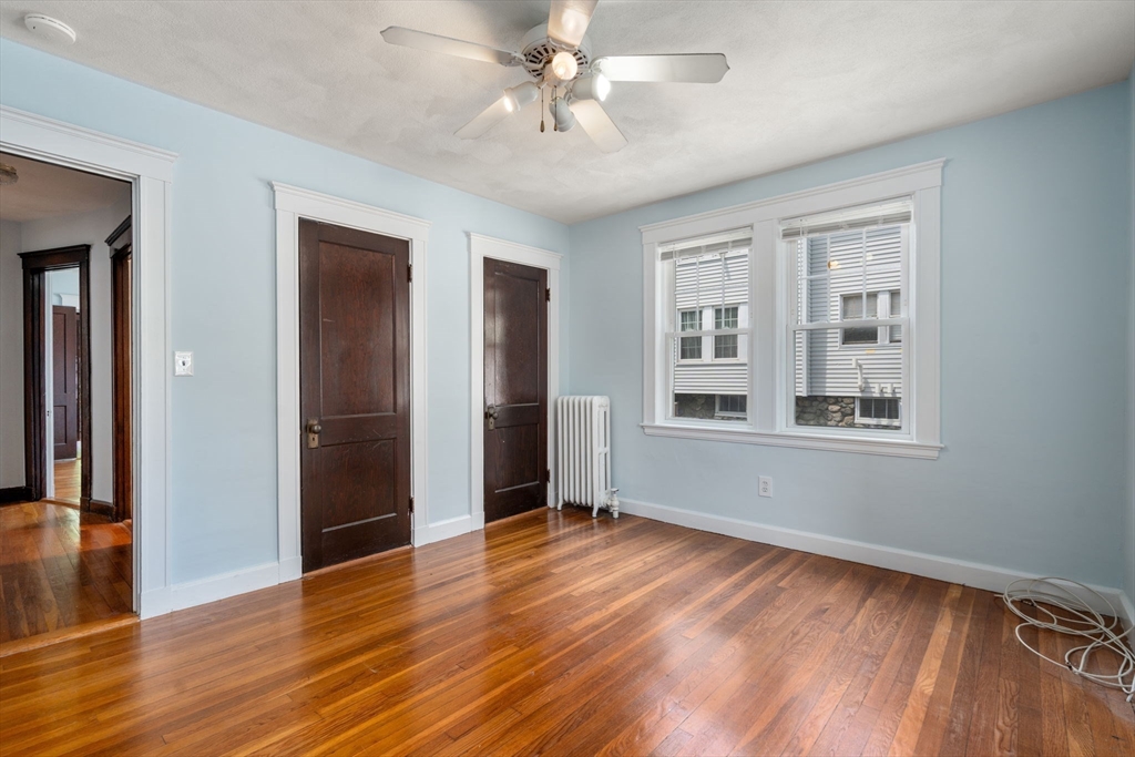 7 Winslow Road Belmont, MA 02478 - Photo 20 of 27 a view of an empty room with window and wooden floor