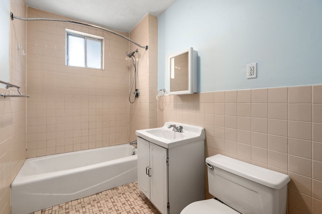 7 Winslow Road Belmont, MA 02478 - Photo 21 of 27 a bathroom with a toilet a sink and bathtub