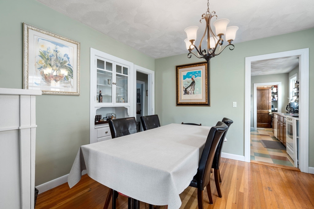 7 Winslow Road Belmont, MA 02478 - Photo 6 of 27 a view of a dining room with furniture wooden floor and chandelier