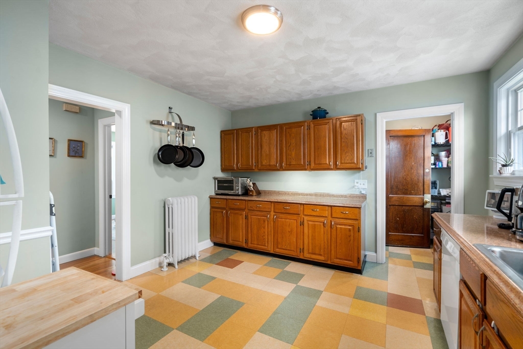 7 Winslow Road Belmont, MA 02478 - Photo 8 of 27 a kitchen with a sink stove and refrigerator