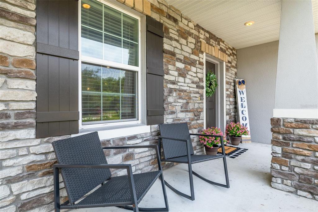 7242 Landmark Drive Spring Hill, FL 34606 - Photo 6 of 45 a balcony with table and chairs