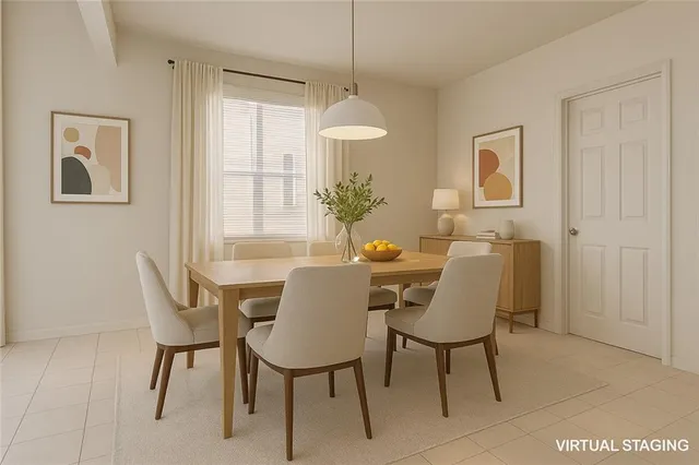 a dining room with furniture and window