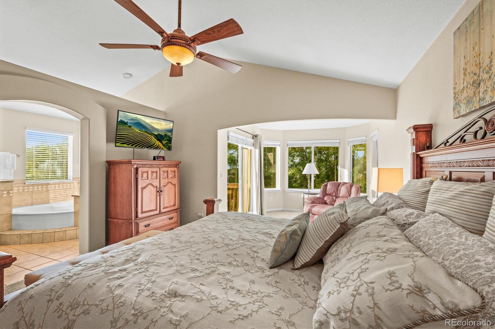 3115 White Oak Lane Highlands Ranch, CO 80129 - Photo 15 of 43 a bedroom with a bed dresser and a large window