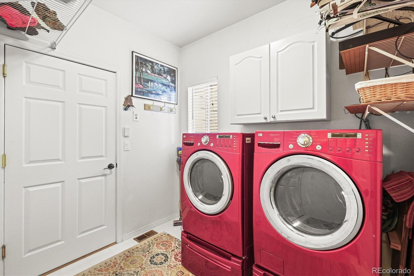 3115 White Oak Lane Highlands Ranch, CO 80129 - Photo 20 of 43 a utility room with dryer and washer