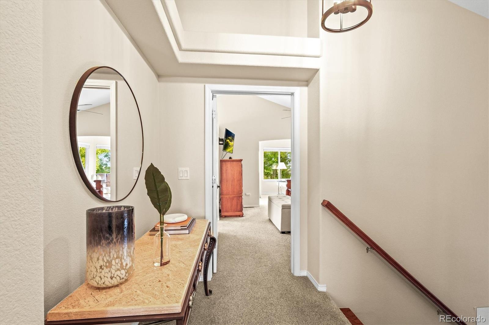 3115 White Oak Lane Highlands Ranch, CO 80129 - Photo 26 of 43 a view of a livingroom with furniture and a mirror