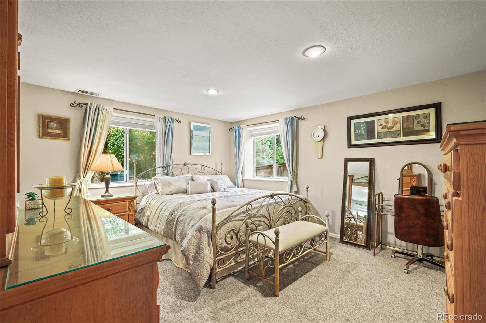 3115 White Oak Lane Highlands Ranch, CO 80129 - Photo 30 of 43 a bed room with a bed and a table