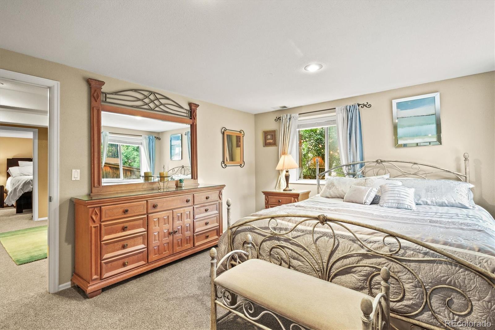 3115 White Oak Lane Highlands Ranch, CO 80129 - Photo 31 of 43 a bedroom with a large bed and a window