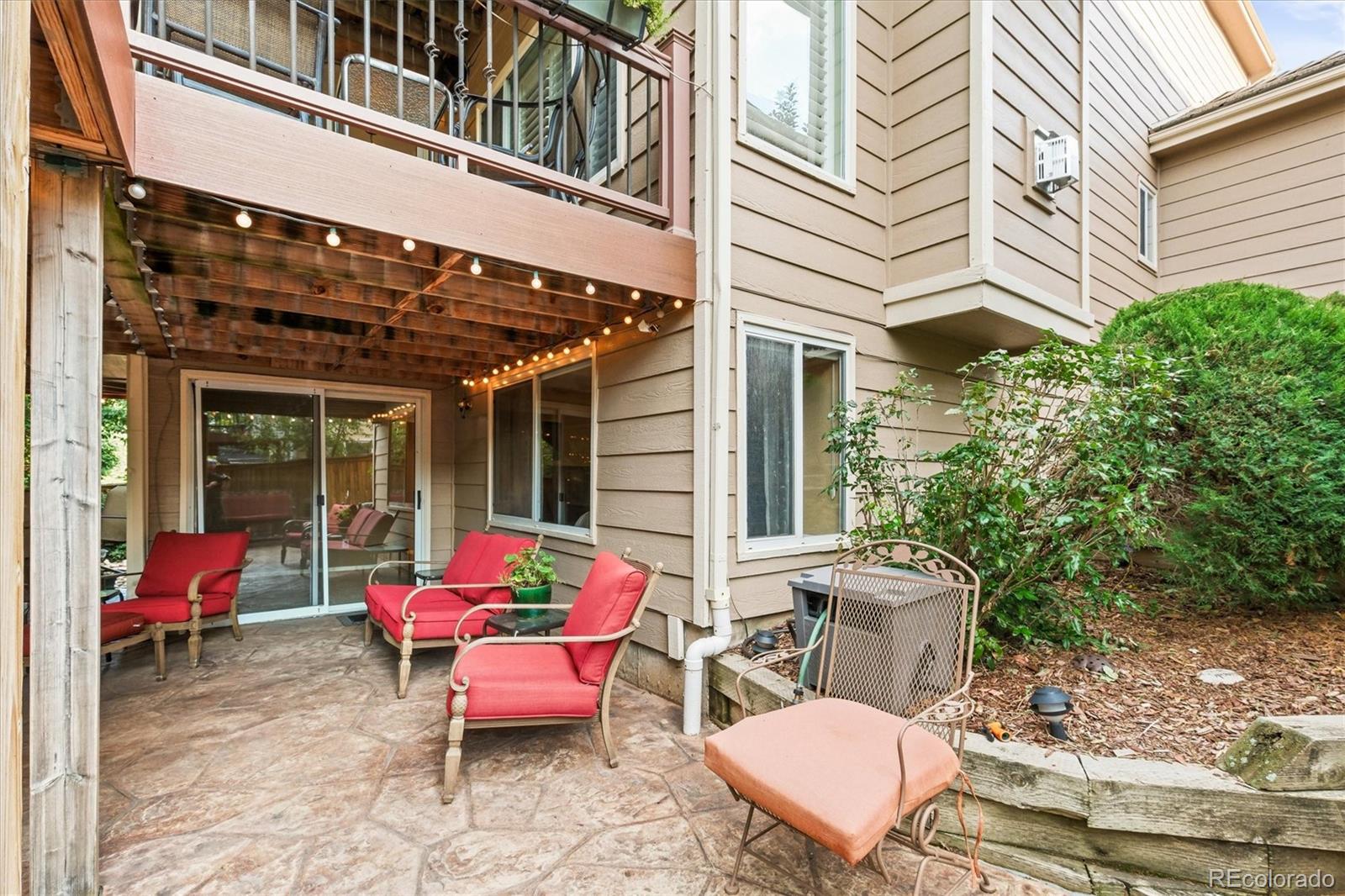 3115 White Oak Lane Highlands Ranch, CO 80129 - Photo 38 of 43 a view of a patio with a table and chairs and potted plants