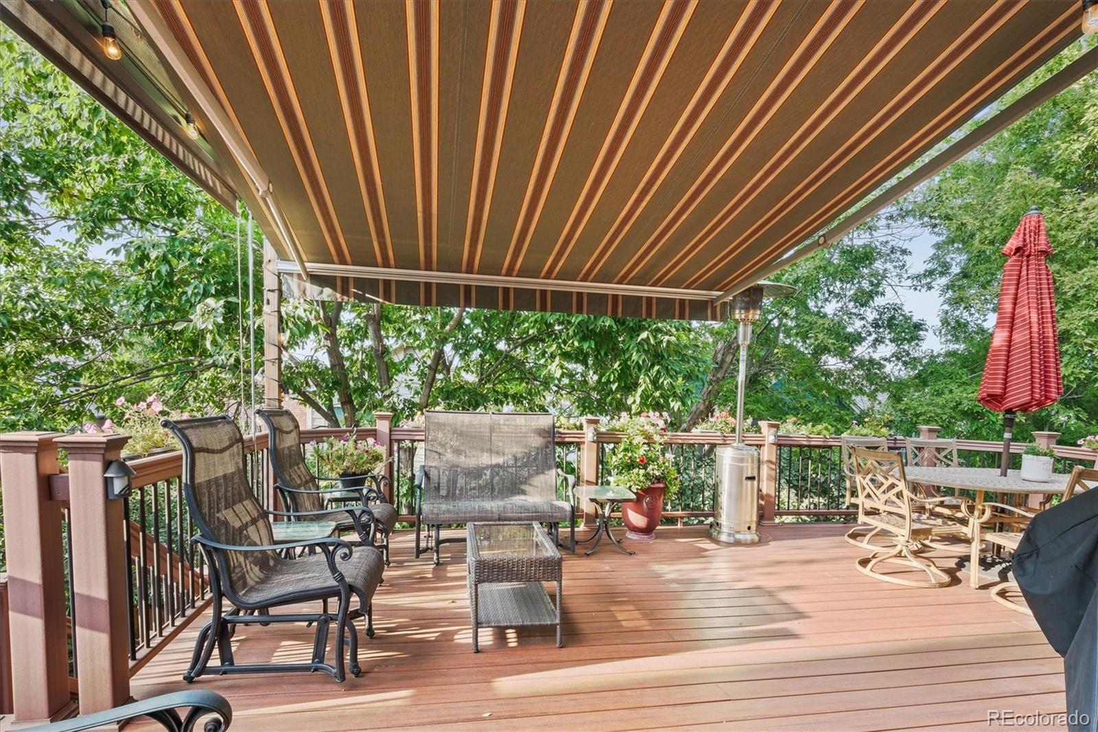 3115 White Oak Lane Highlands Ranch, CO 80129 - Photo 40 of 43 a patio with table and chairs and potted plants